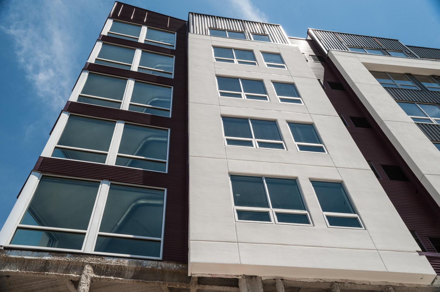 Wide angle side street view Walnut Capital apartments