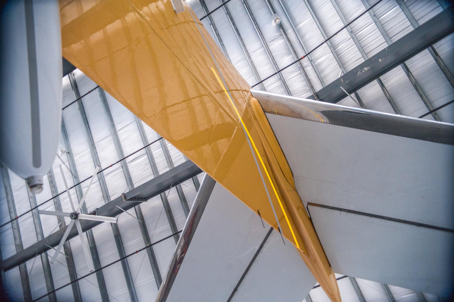 Inside of hanger with plane in shot