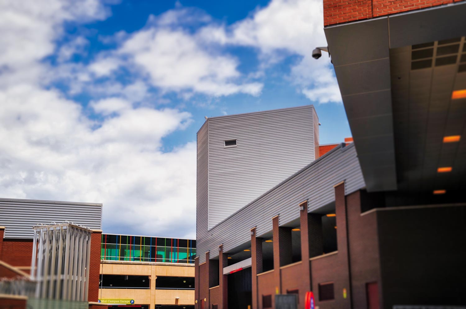 Front of garage Children's Hospital metal patina panels installed plus accent orange,green,purple,and gray louvers photograph